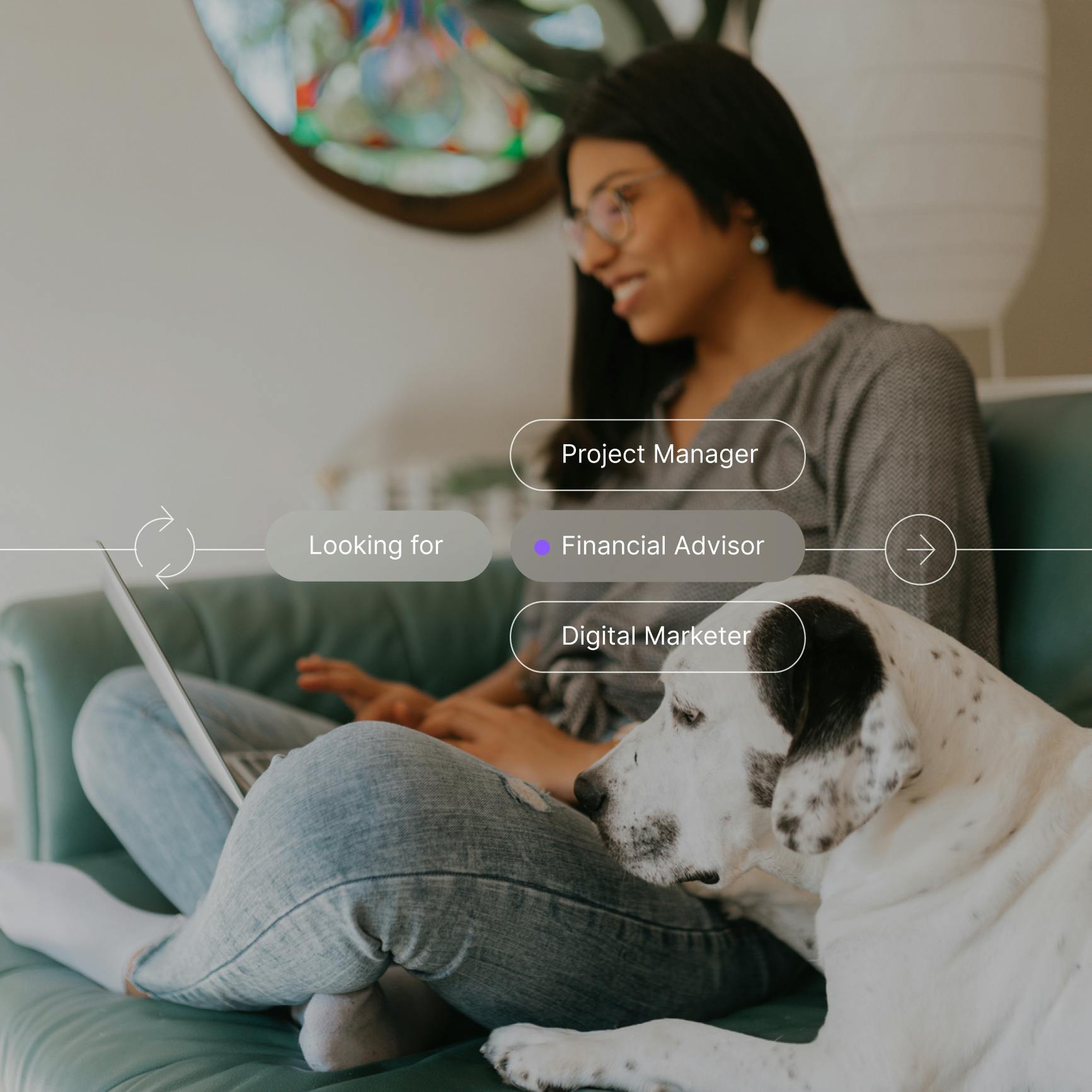A woman with a laptop sitting next to a dog
